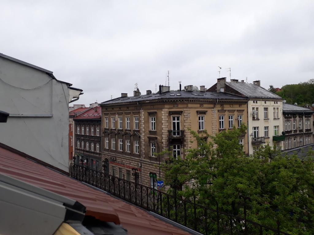 a view of an old building from a balcony at Apartament Limanowskiego in Kraków
