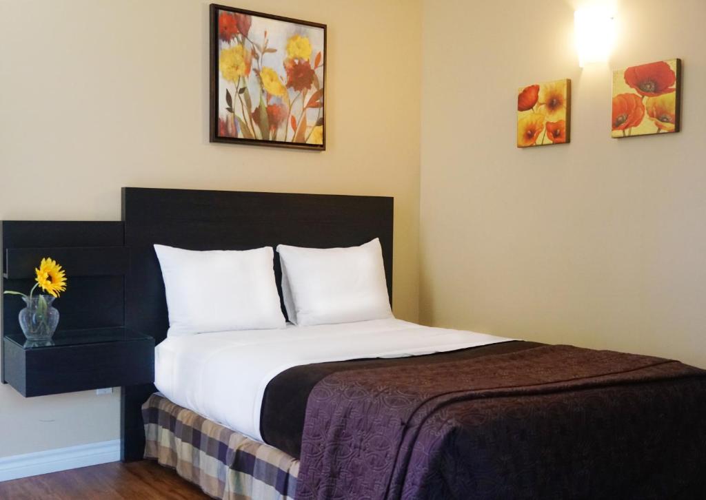 Postel nebo postele na pokoji v ubytování Motel des Cèdres