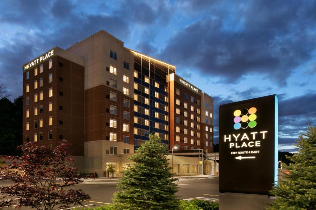 a hyatt place sign in front of a building at Hyatt Place Fort Lee/George Washington Bridge in Fort Lee