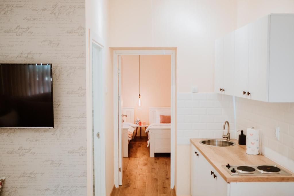 Η κουζίνα ή μικρή κουζίνα στο Apartman Cute&Cosy Lux