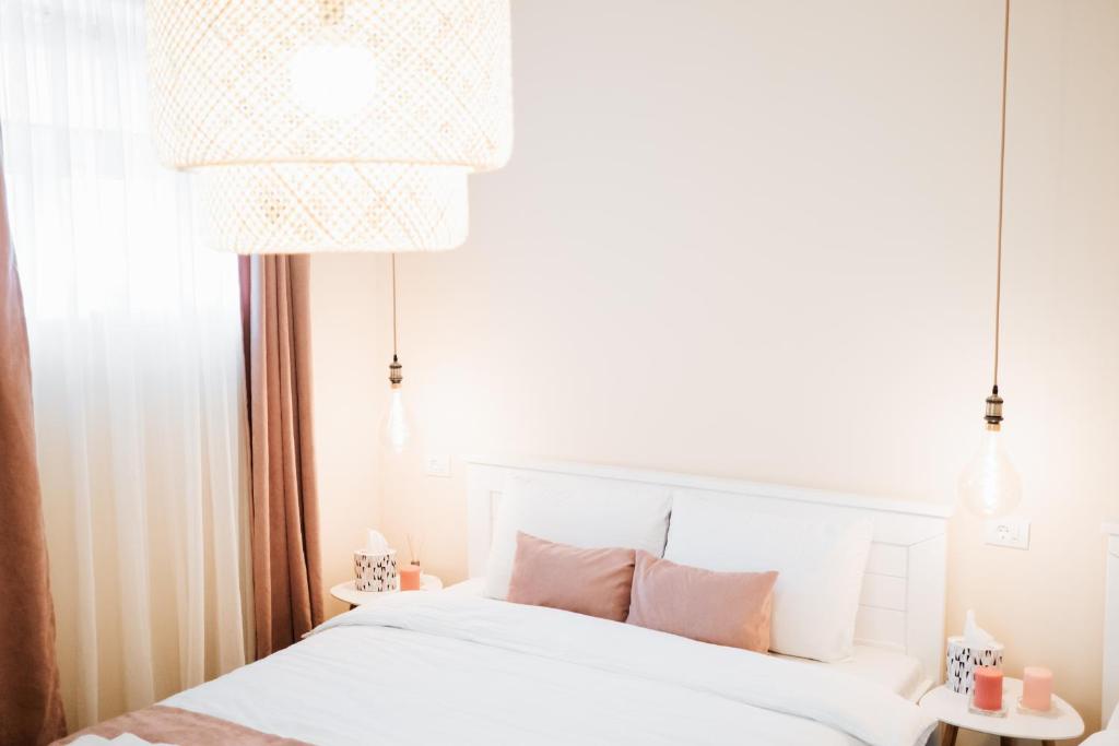Ένα ή περισσότερα κρεβάτια σε δωμάτιο στο Apartman Cute&Cosy Lux