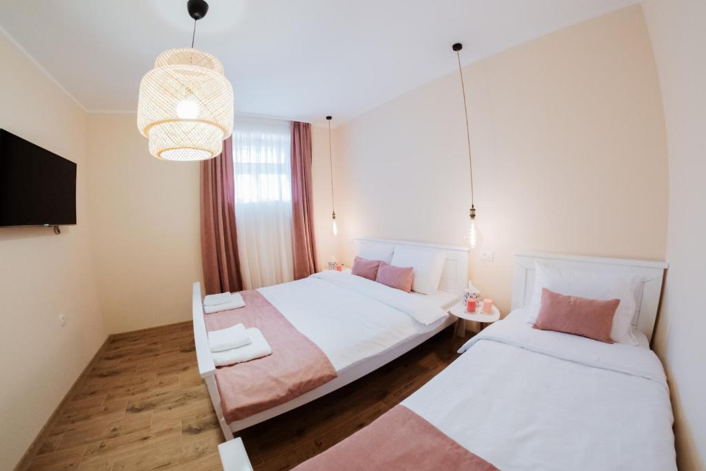 Ένα ή περισσότερα κρεβάτια σε δωμάτιο στο Apartman Cute&Cosy Lux