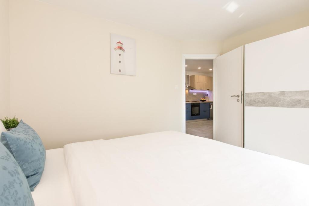 Łóżko lub łóżka w pokoju w obiekcie Apartman Mares