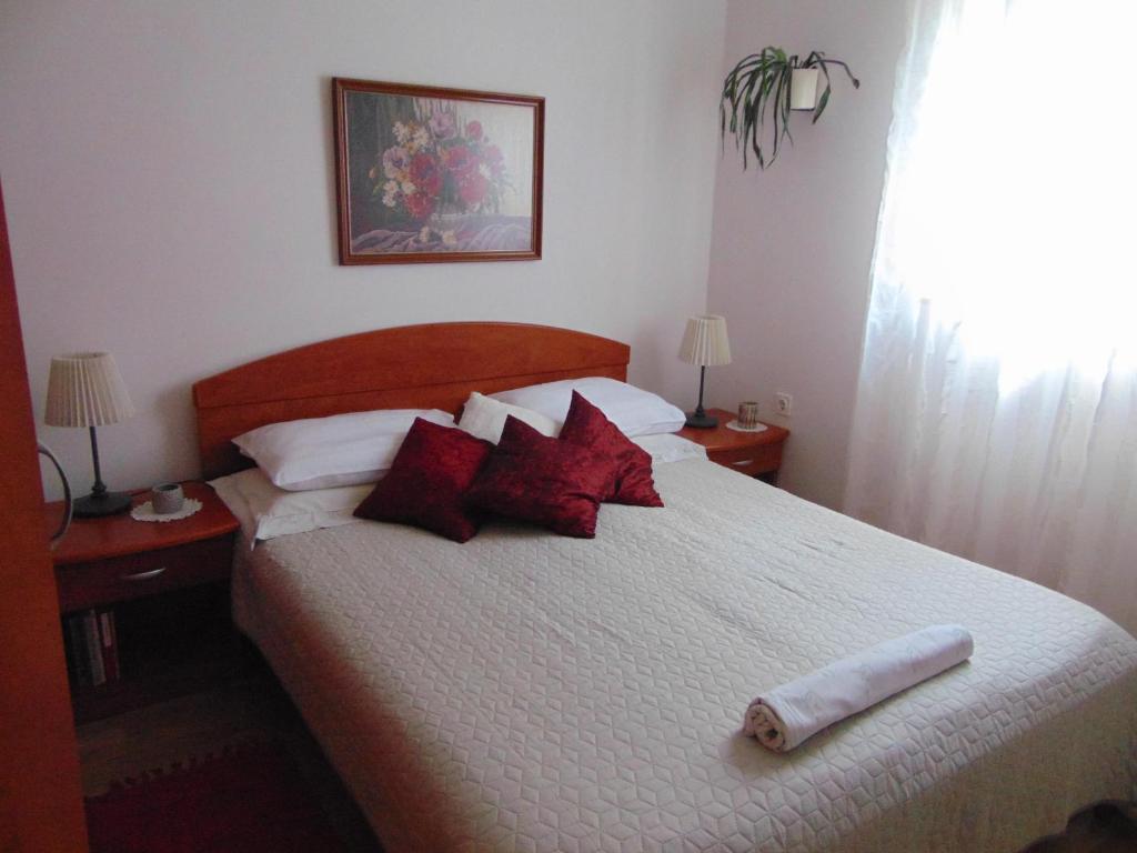 Postel nebo postele na pokoji v ubytování Apartments Petra