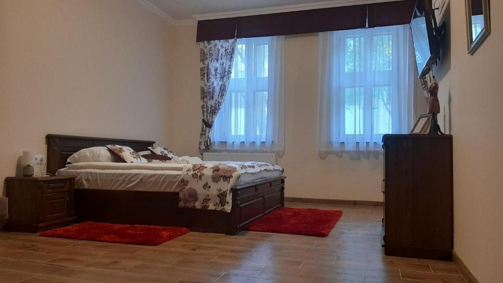 Posteľ alebo postele v izbe v ubytovaní Toscana Apartman