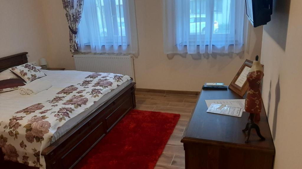 Posteľ alebo postele v izbe v ubytovaní Toscana Apartman