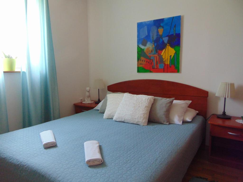 Postel nebo postele na pokoji v ubytování Apartments Petra