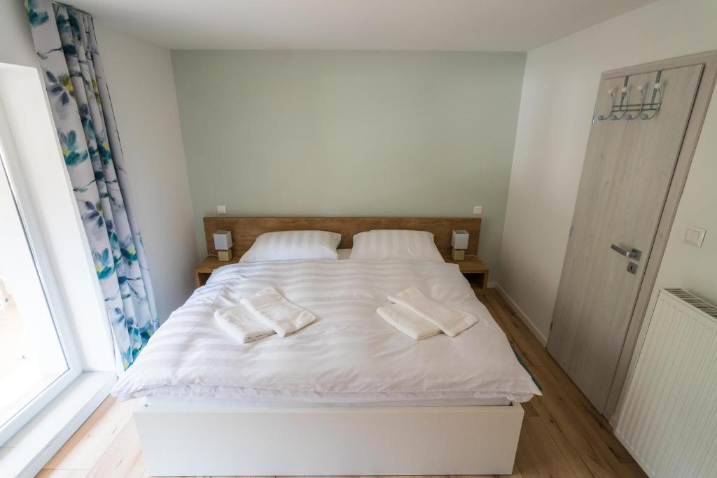 Postel nebo postele na pokoji v ubytování Apartmány EMA a PETER