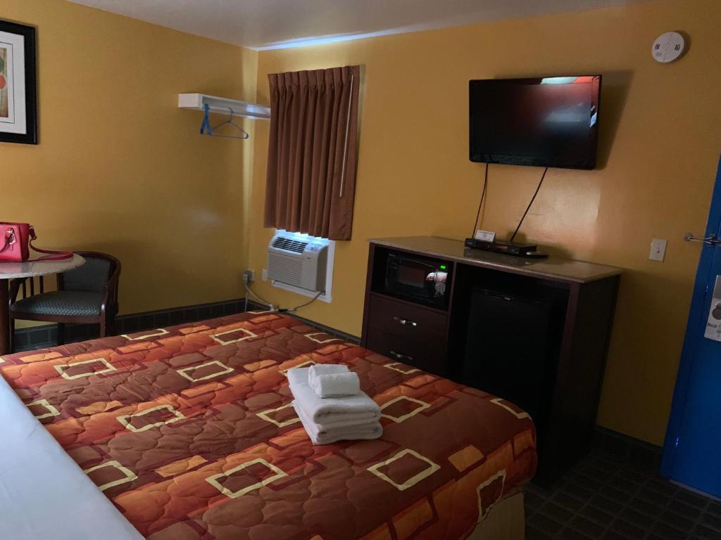 Postel nebo postele na pokoji v ubytování Scottish Inns Wrightstown