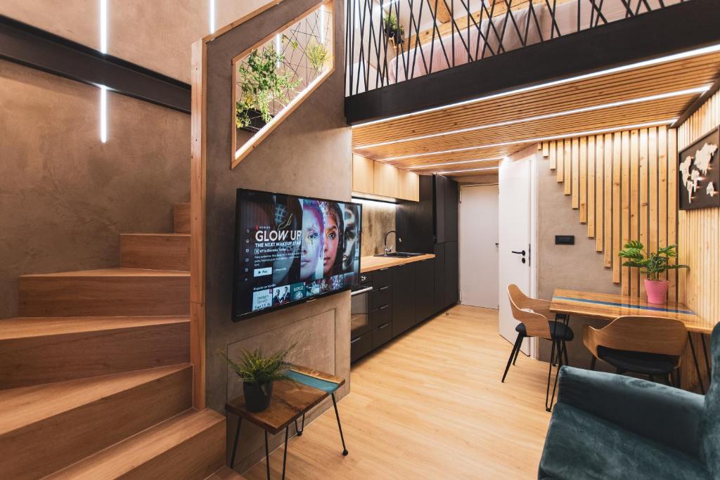TV a/nebo společenská místnost v ubytování Gami Ex-Factory Lofts