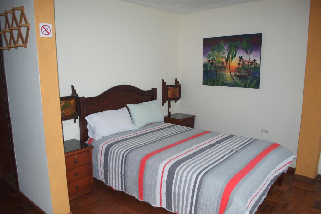 Postel nebo postele na pokoji v ubytování Hostal Monte Carmelo