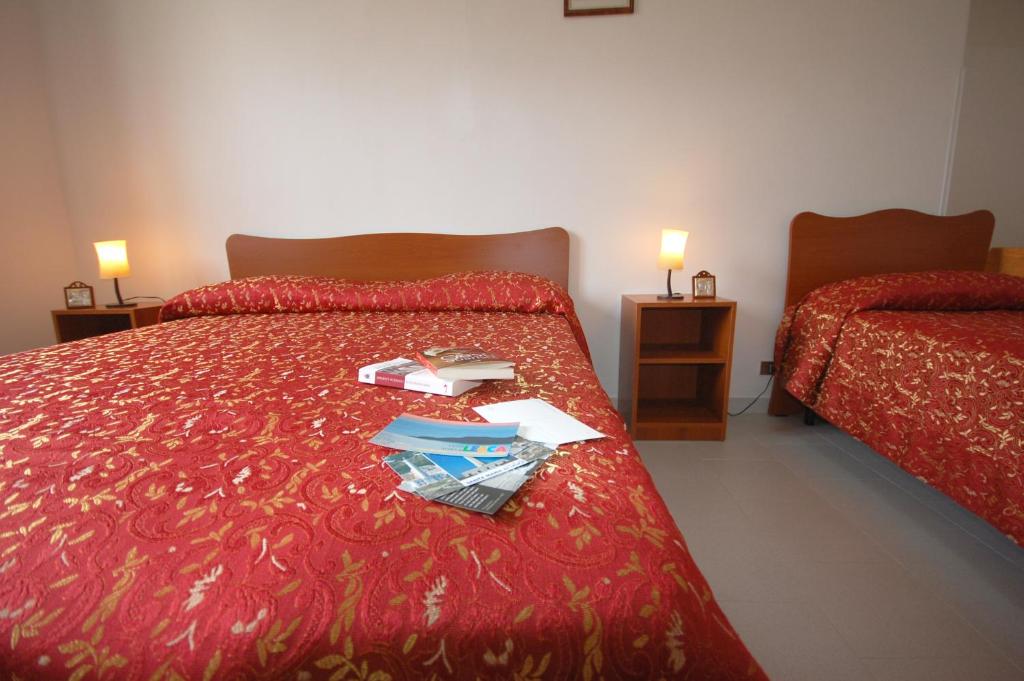 Postel nebo postele na pokoji v ubytování Albergo Del Santuario