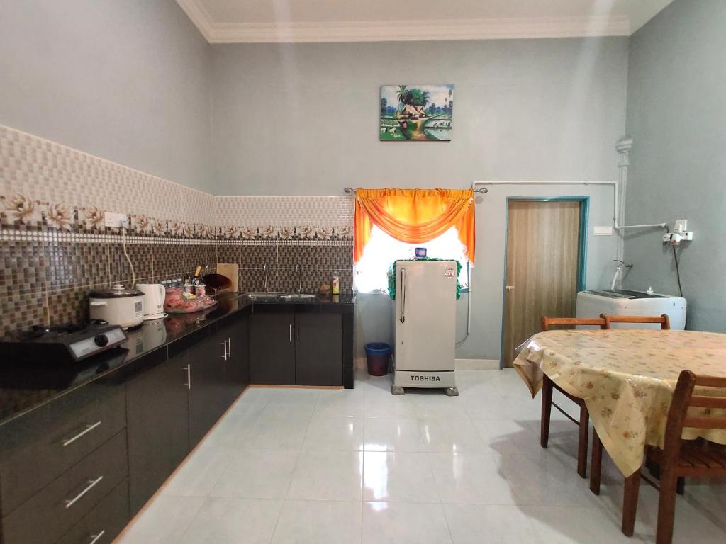 Kuchyň nebo kuchyňský kout v ubytování Ku's Roomstay