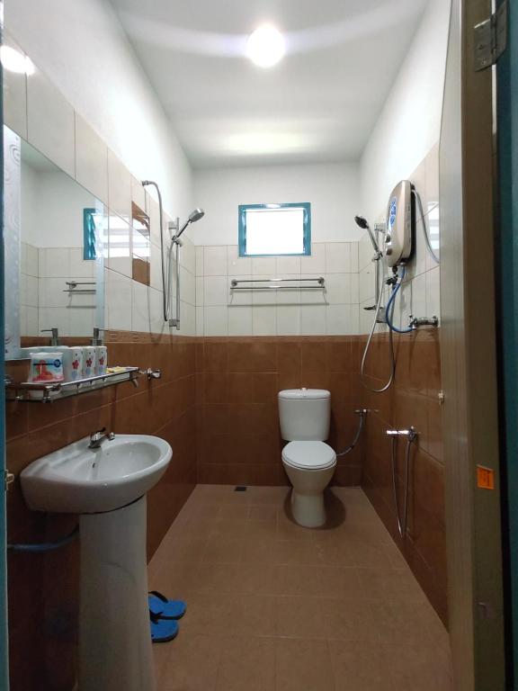 Koupelna v ubytování Ku's Roomstay