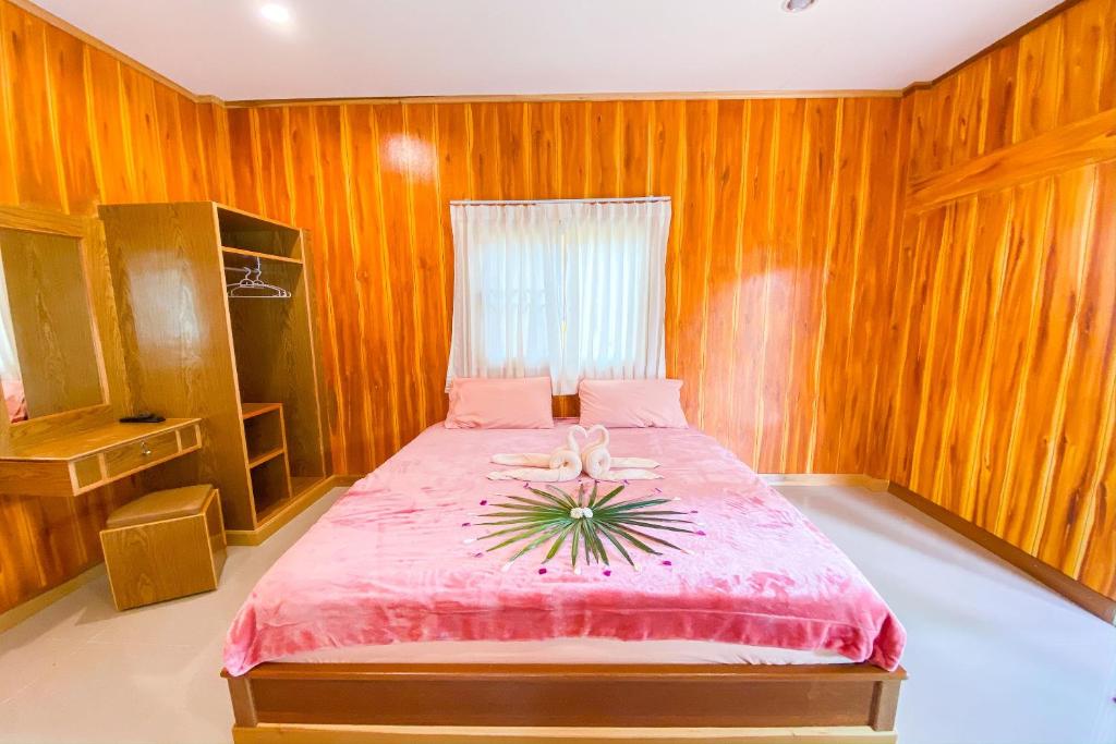 Postel nebo postele na pokoji v ubytování Koh Kood Far East Resort
