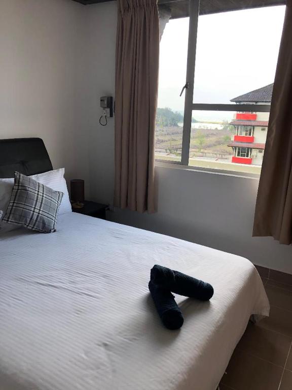 Postel nebo postele na pokoji v ubytování Kerteh Apartment