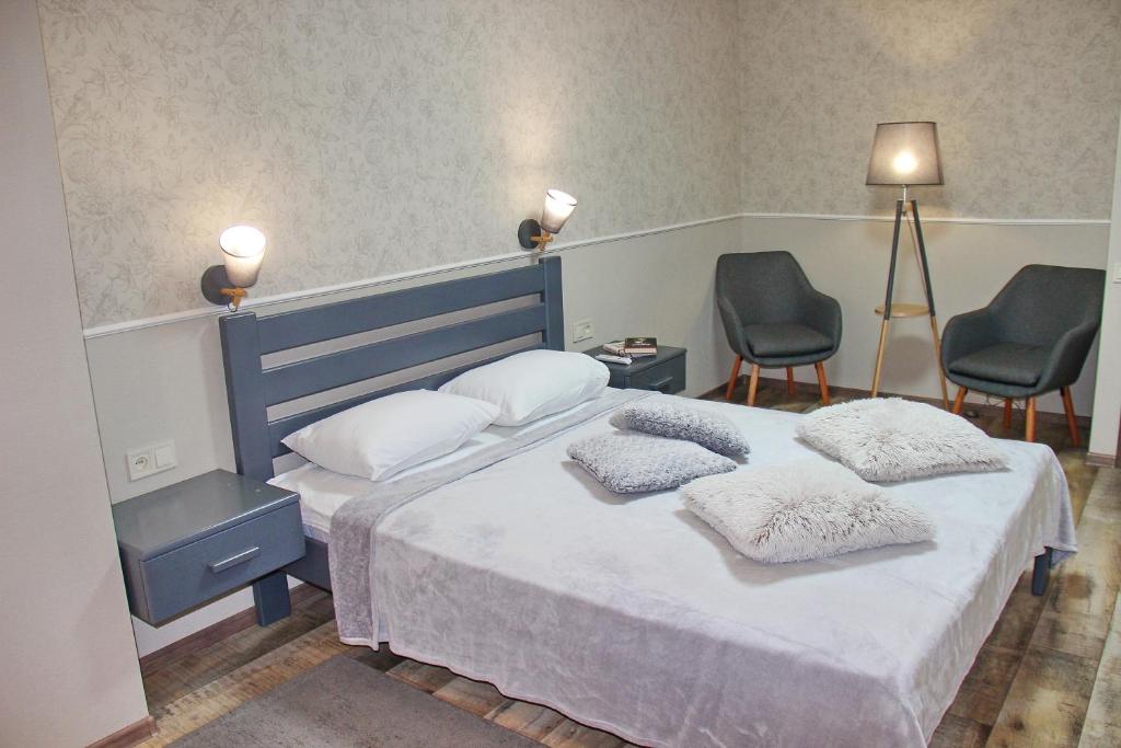 Postel nebo postele na pokoji v ubytování Molex Apartments 3