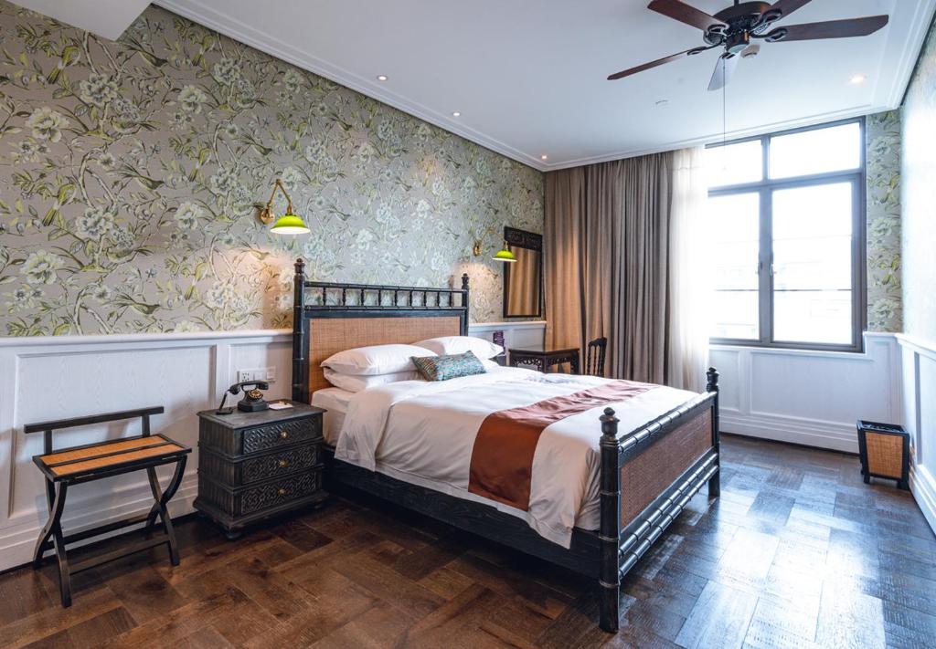 Postel nebo postele na pokoji v ubytování Guangzhou Nansha Stone Inn