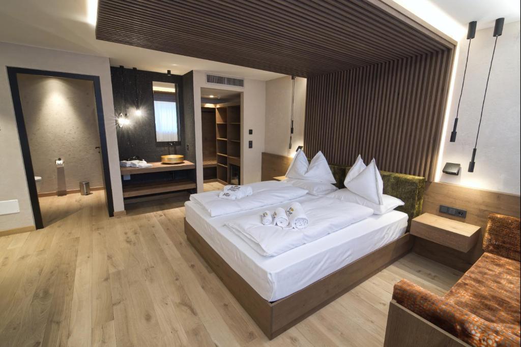 Postel nebo postele na pokoji v ubytování Bonfanti Design Hotel