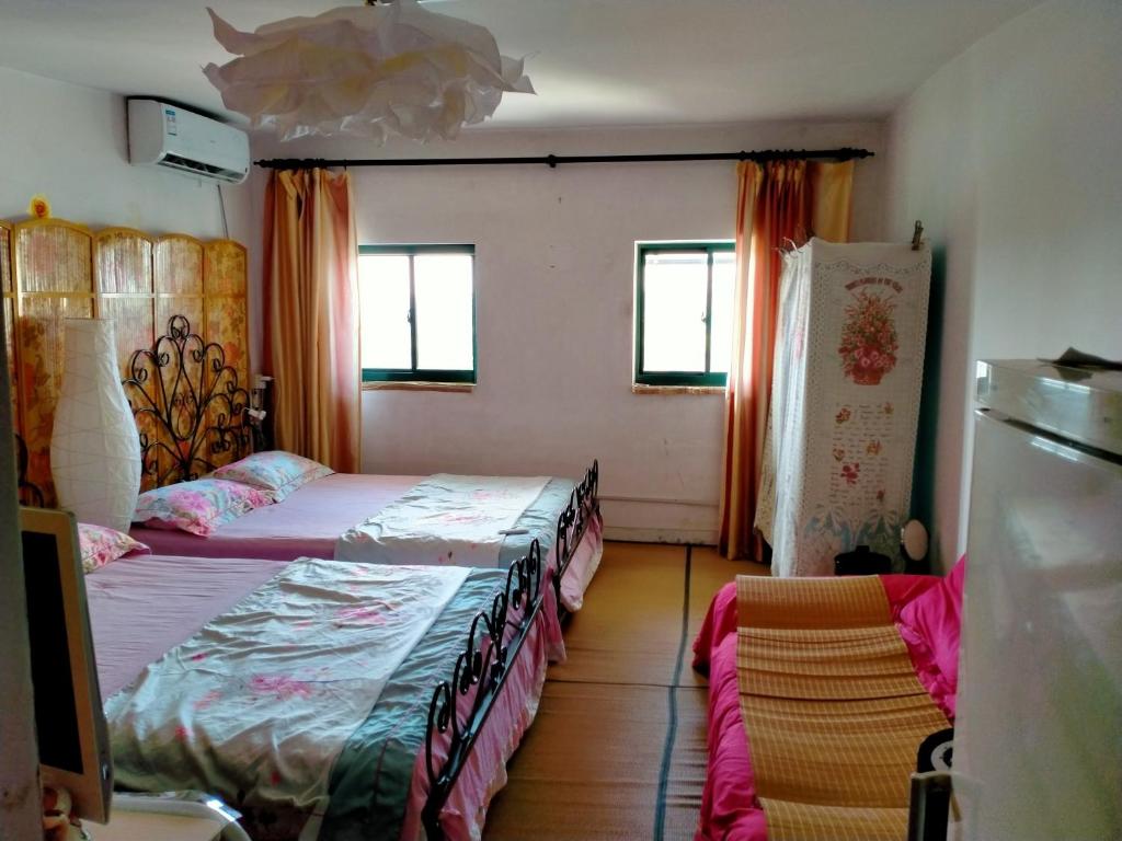 Postel nebo postele na pokoji v ubytování Yi Ju Homestay-ZhuanQiao Subway Station, MinHang District