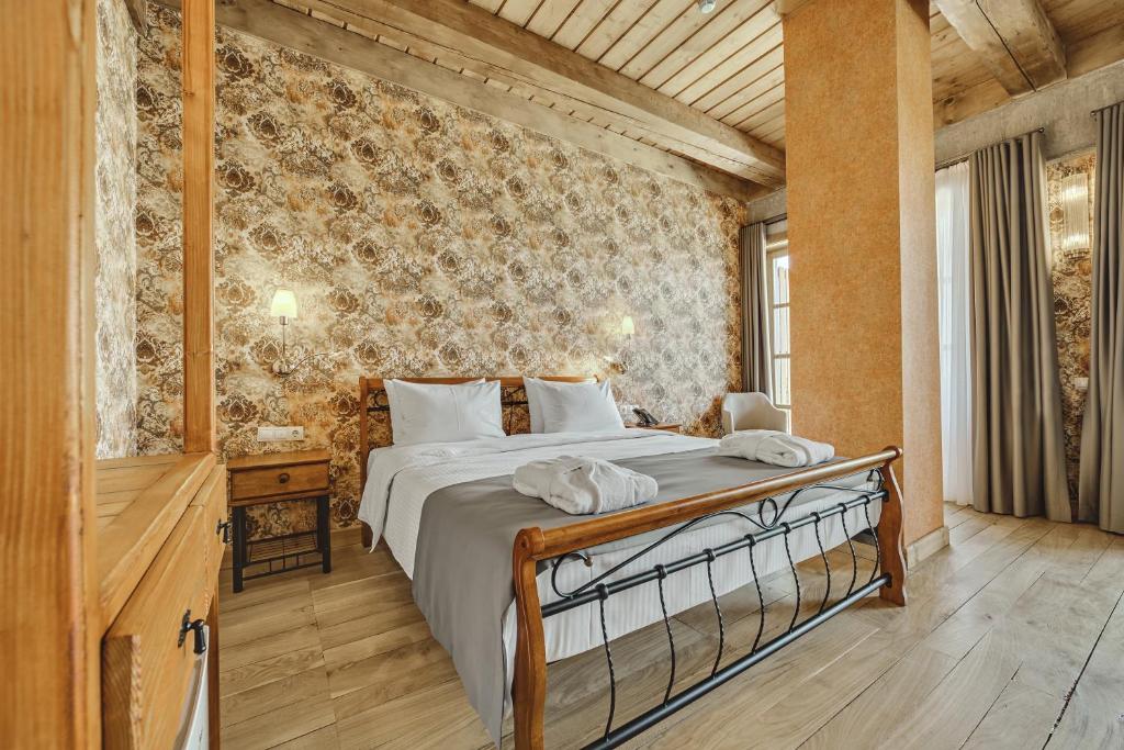 Postel nebo postele na pokoji v ubytování Ampelo Resort