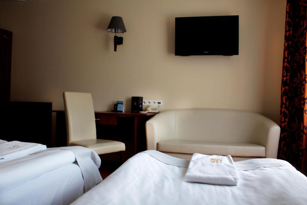 Łóżko lub łóżka w pokoju w obiekcie Hotel Gordon
