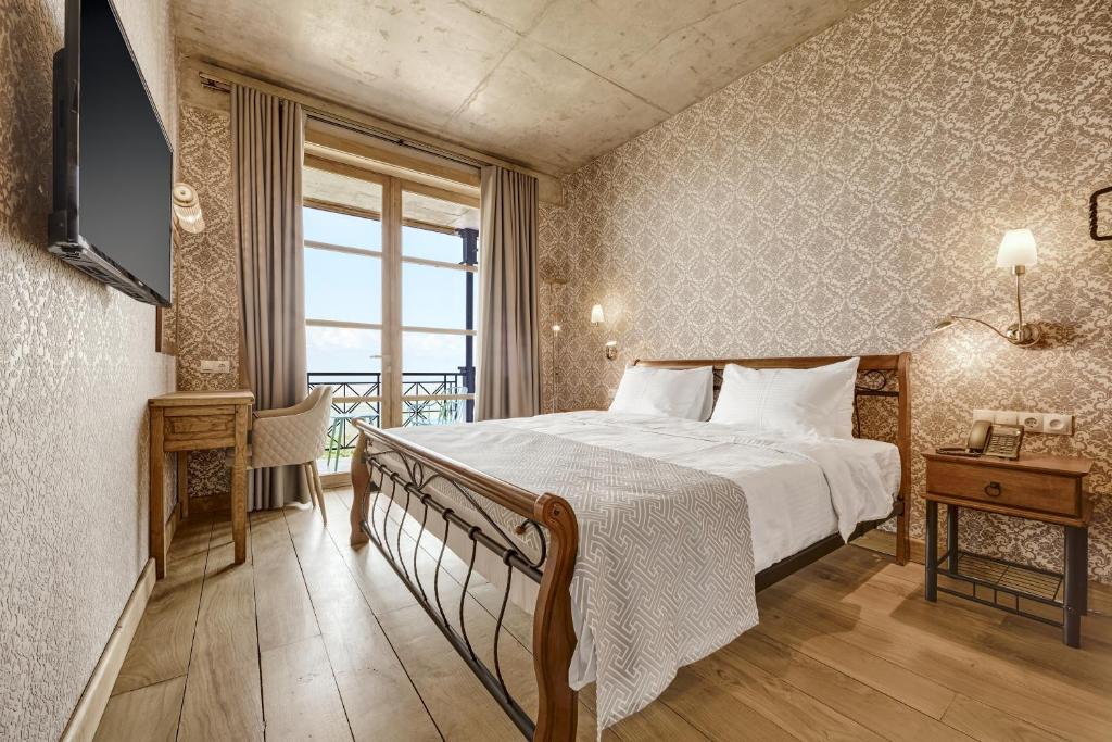 Postel nebo postele na pokoji v ubytování Ampelo Resort