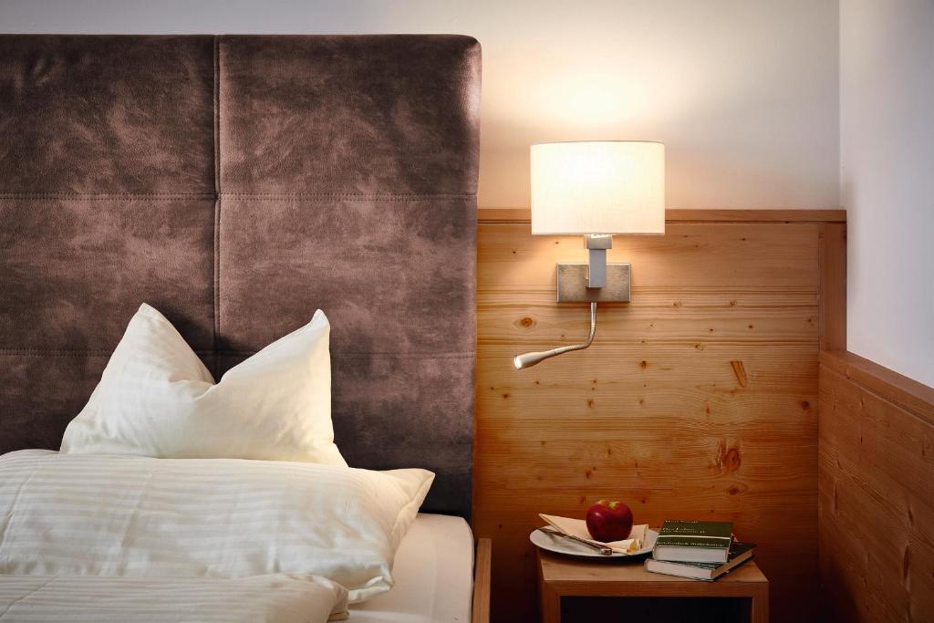 Postel nebo postele na pokoji v ubytování Hotel Platzl
