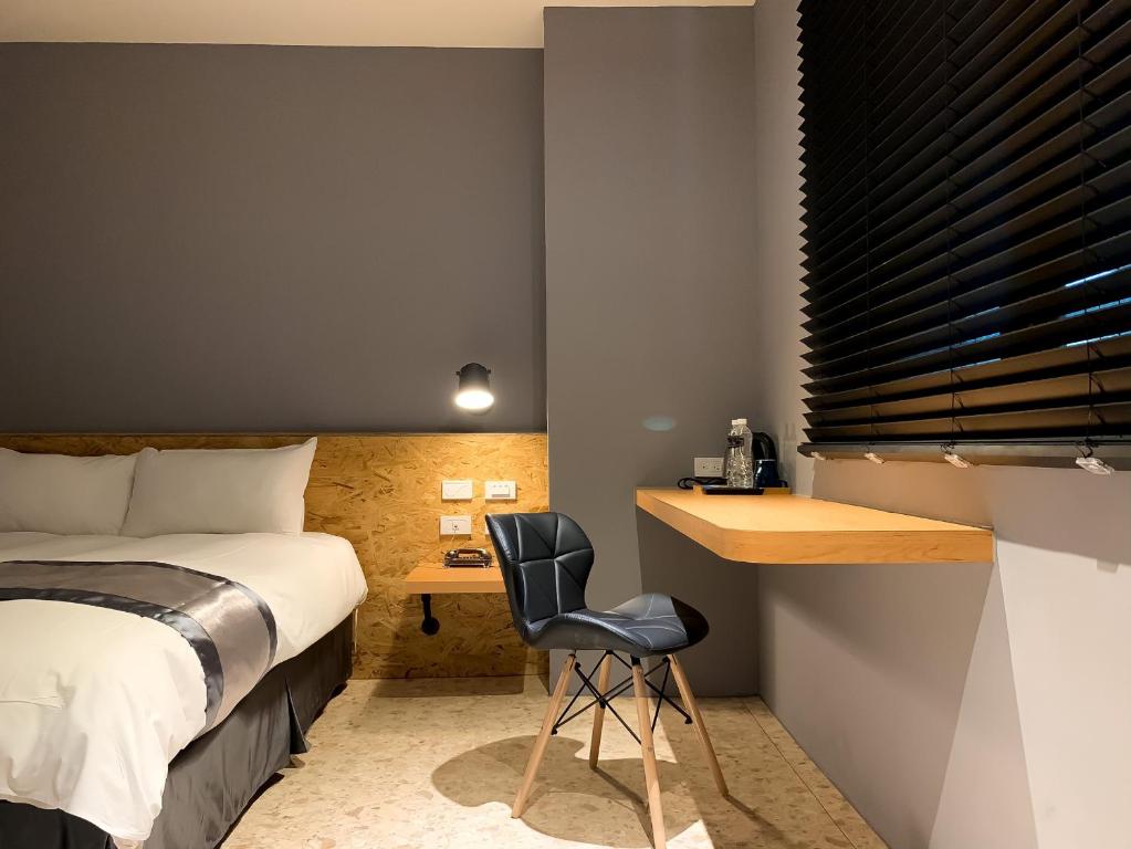 Postel nebo postele na pokoji v ubytování Raise Hotel Taichung