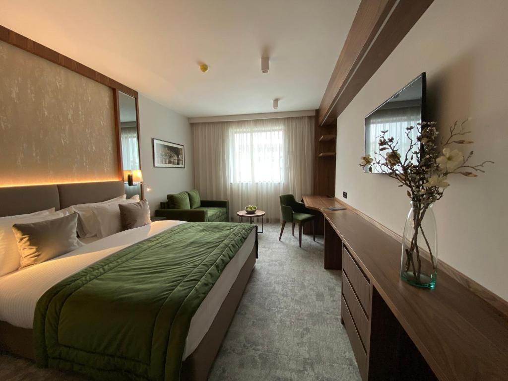 Postel nebo postele na pokoji v ubytování Central Point Hotel Beograd