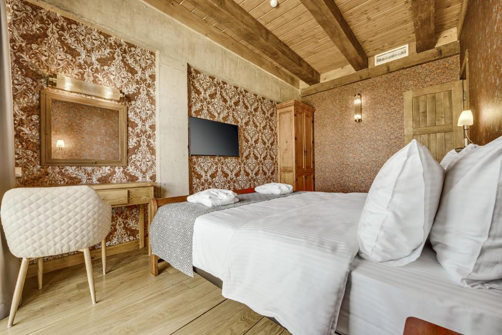 Postel nebo postele na pokoji v ubytování Ampelo Resort