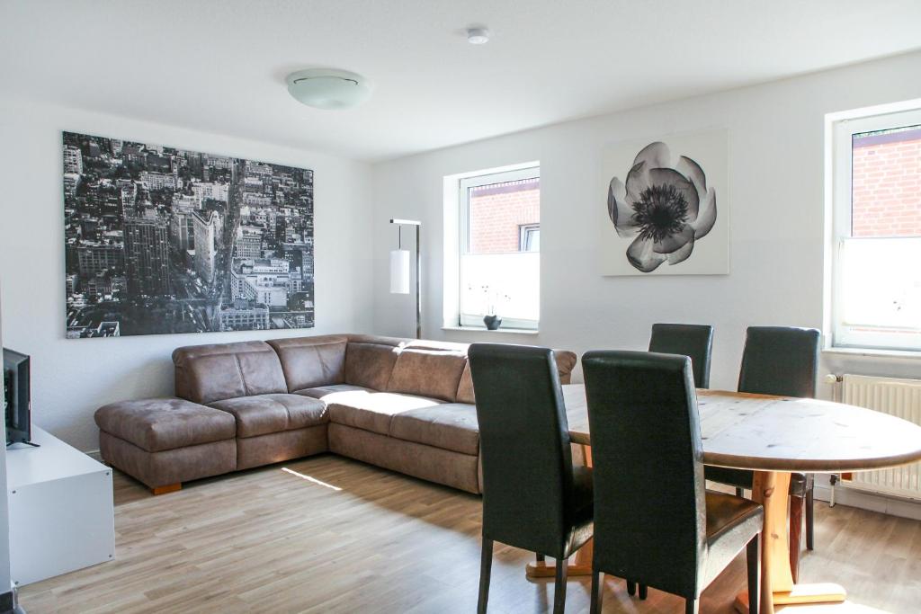a living room with a couch and a table at Apartment "New York" in Korschenbroich