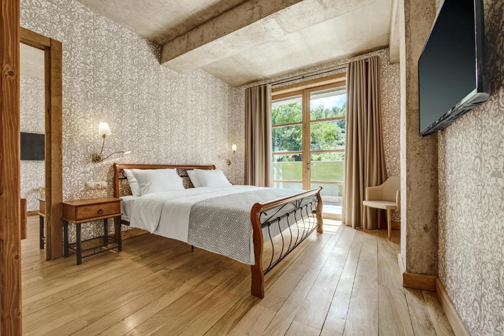 Postel nebo postele na pokoji v ubytování Ampelo Resort