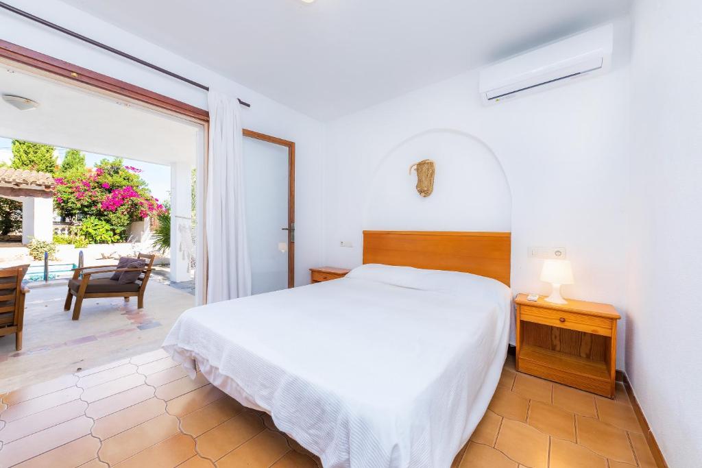 A bed or beds in a room at Villa Beach Palmitos