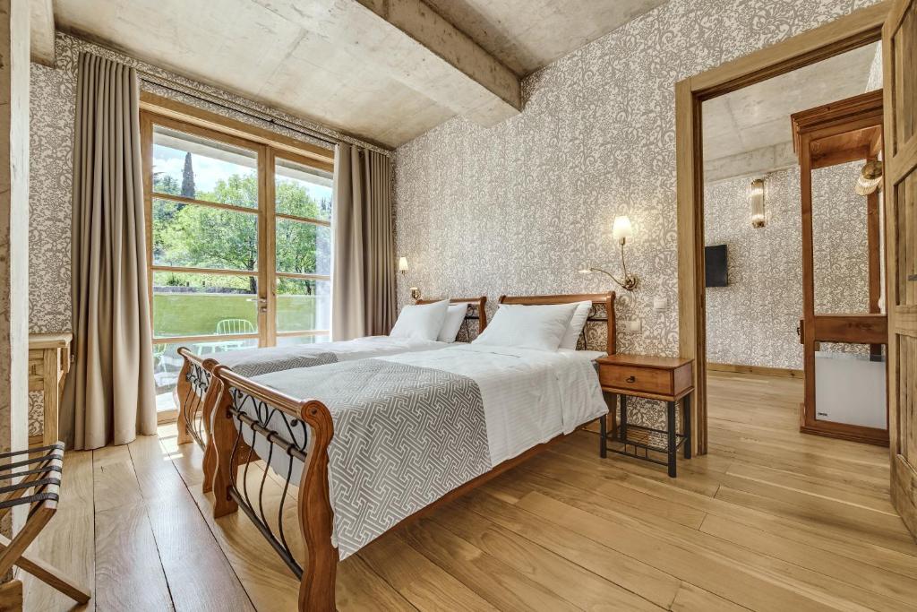 Postel nebo postele na pokoji v ubytování Ampelo Resort