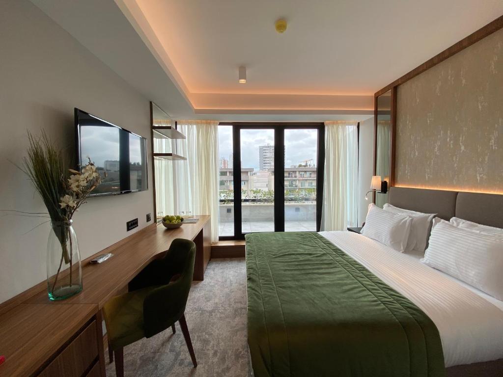Postel nebo postele na pokoji v ubytování Central Point Hotel Beograd