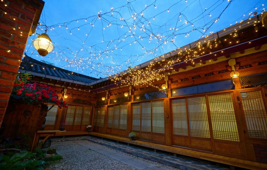 a building with a string of lights on it at Jungdam in Jeonju