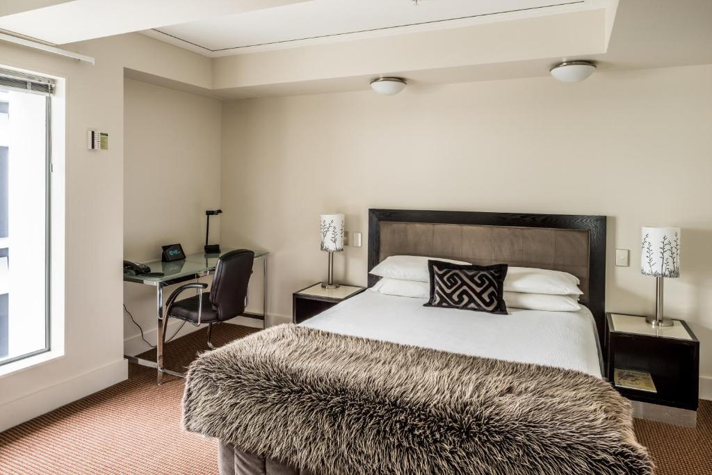 Postel nebo postele na pokoji v ubytování Bolton Hotel