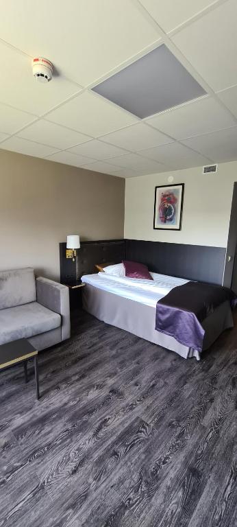 Postel nebo postele na pokoji v ubytování First Hotel Royal