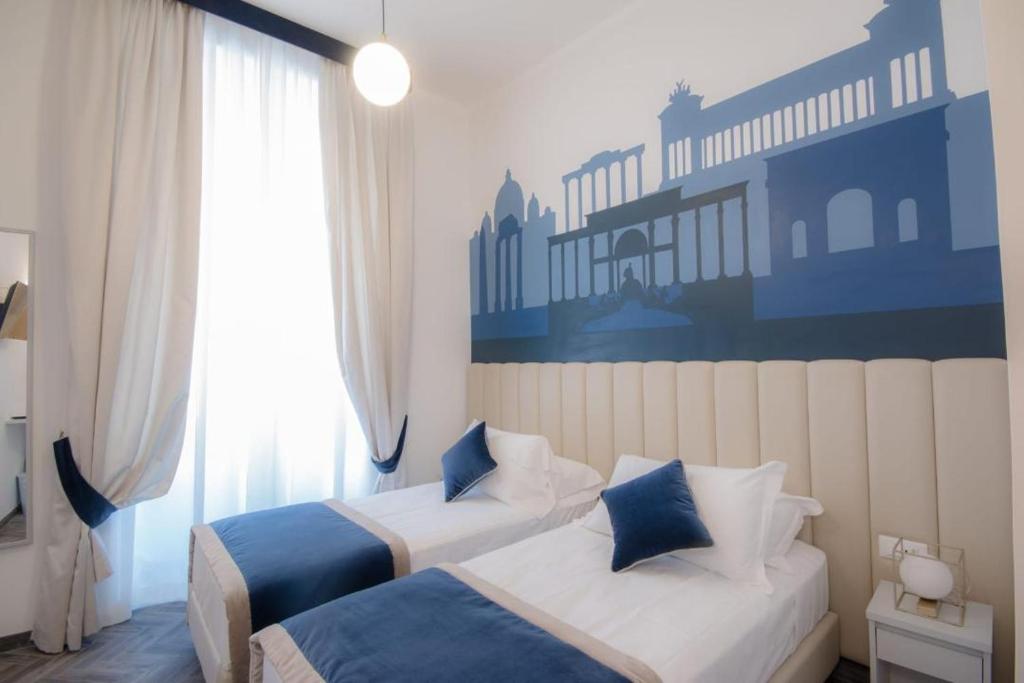 Posteľ alebo postele v izbe v ubytovaní Frattina FF italian suites