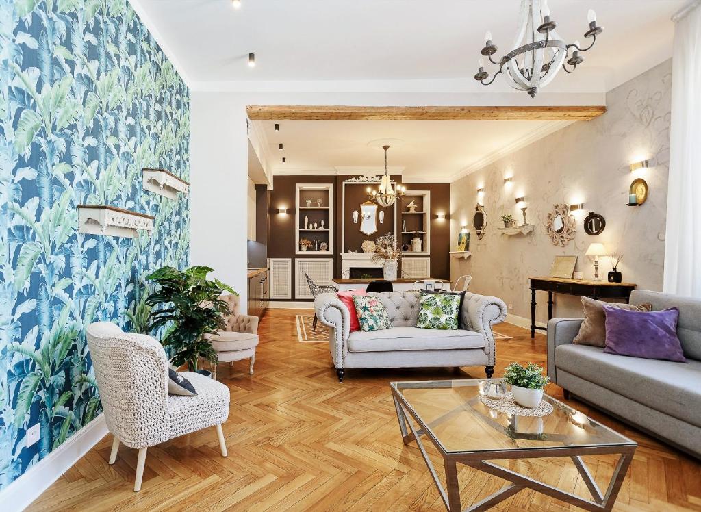 a living room with a couch and a table at Riga Old Town Jāņa Sēta Residence in Riga