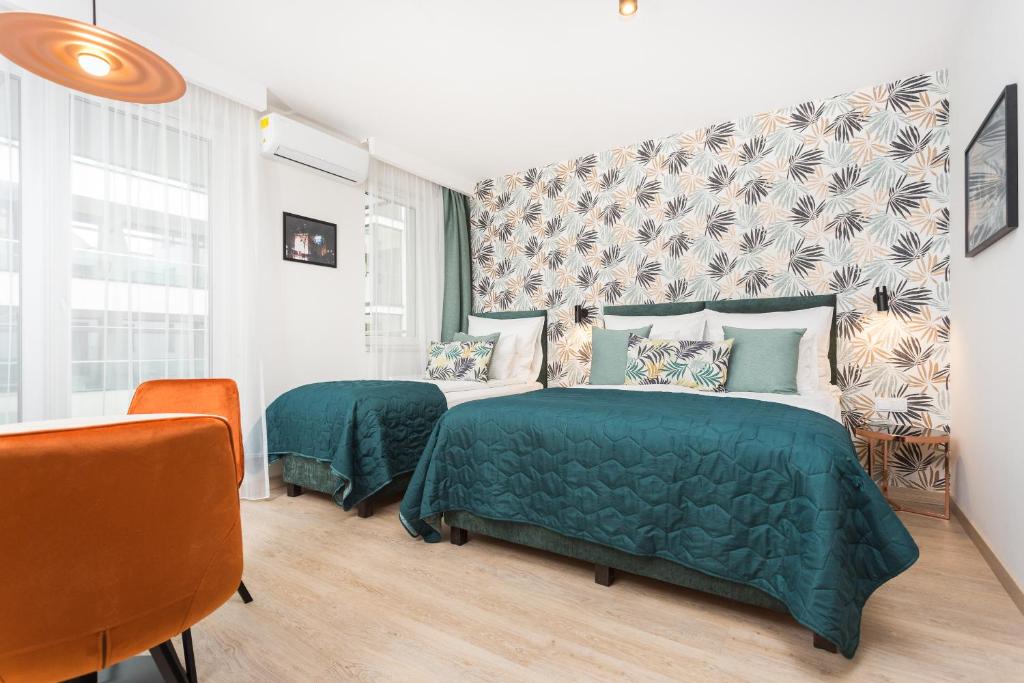 Posteľ alebo postele v izbe v ubytovaní InPoint Apartments G11 near Old Town & Kazimierz District & Parking Option