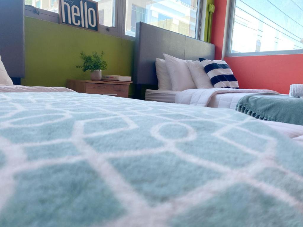 Una cama o camas en una habitación de Conturce Hostel