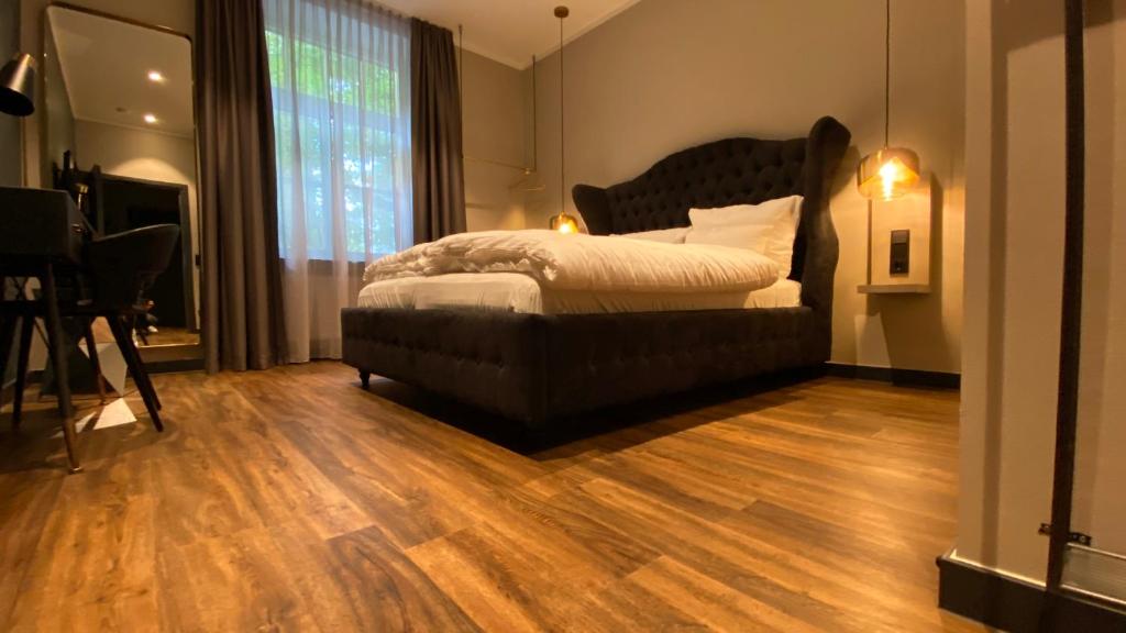 Postel nebo postele na pokoji v ubytování Munich Rooms Hotel