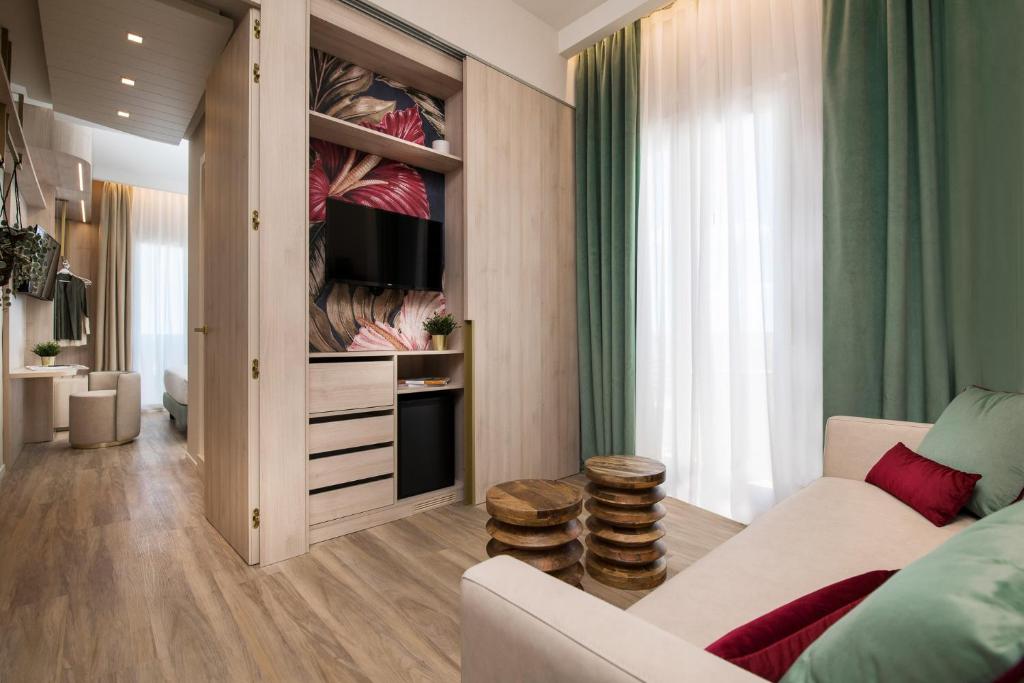 Postel nebo postele na pokoji v ubytování Litoraneo Suite Hotel