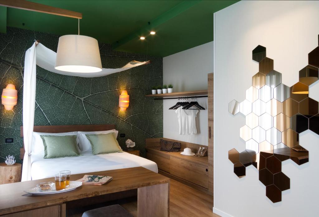 Postel nebo postele na pokoji v ubytování Litoraneo Suite Hotel