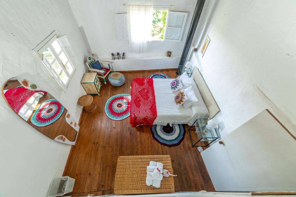 an overhead view of a bedroom with a bed and a bathroom at Casita Collado 3 in Alájar