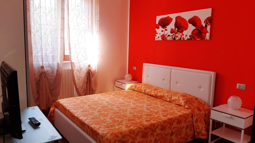 A bed or beds in a room at Le Palme Sona