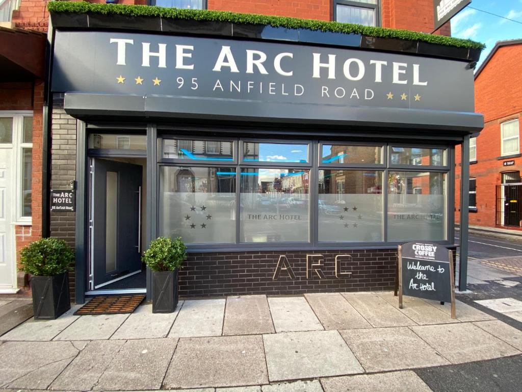 an arc hotel on a street with a sign in front at The Arc Hotel in Liverpool