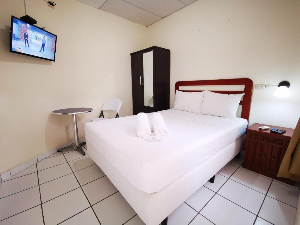 Ένα ή περισσότερα κρεβάτια σε δωμάτιο στο Hotel Armonía Hostal